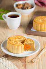 Mooncake with tea cup and nuts.