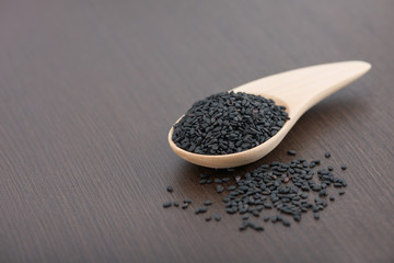 Black sesame seed on wooden spoon