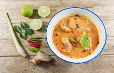 Spicy fish soup traditional food cuisine in Thailand on wooden table,Tom Yum