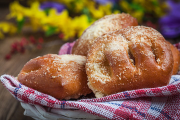 Buns with berries on a wooden table.