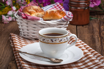 Buns with berries on a wooden table.