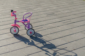 Kids tricycle in the street