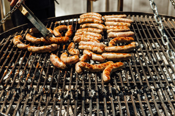 Assorted meat and vegetables grilling over fire