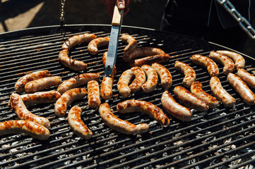 Assorted meat and vegetables grilling over fire