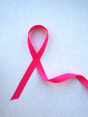 pink ribbon breast cancer on pink background