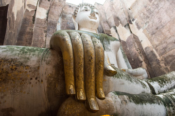 Hands of Buddha Status Buddha statue in Wat Si Chum at Sukhothai Historical park, Thailand
