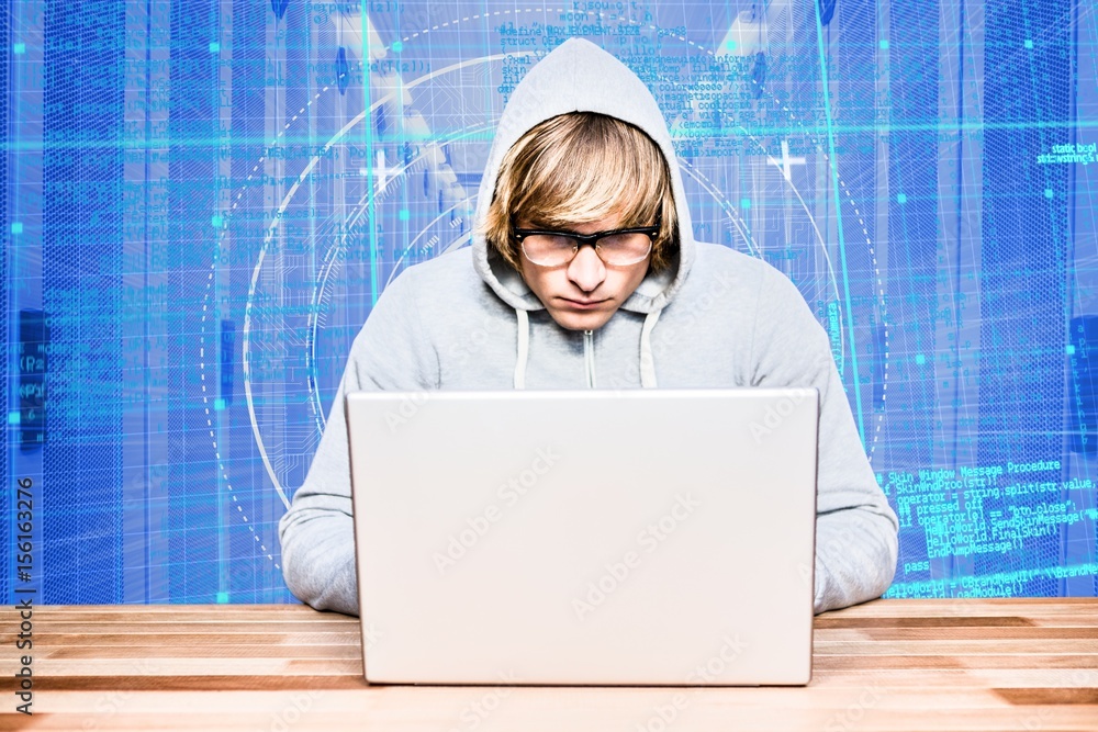 Aufkleber hacker using a laptop with a blue digital background