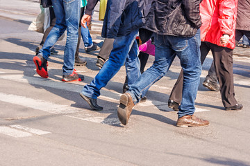 people crossing the pedestrian crossing