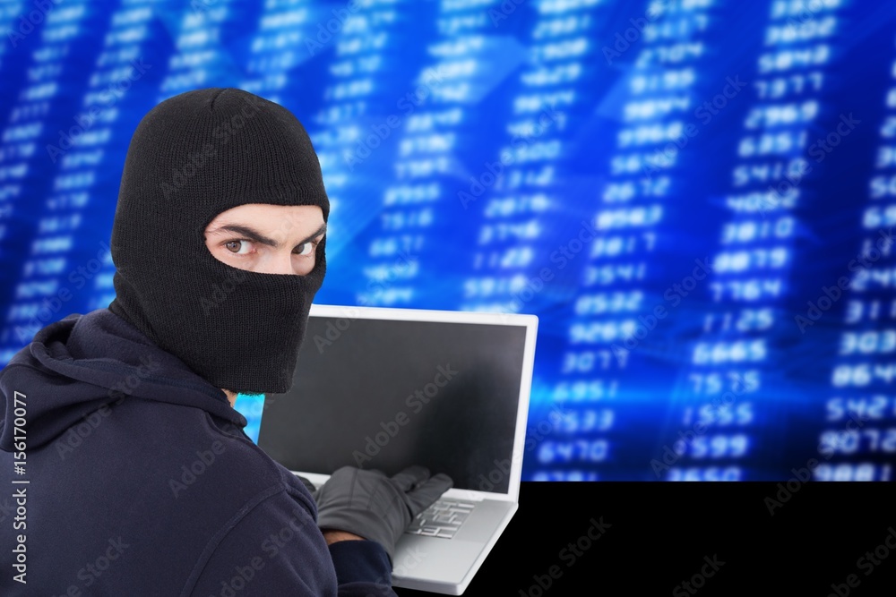 Poster hacker using a laptop with a blue digital background