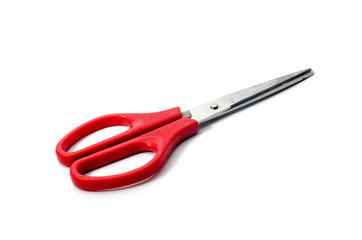 Red scissors white background
