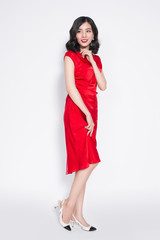 Amazing luxury asian woman in stylish red party dress