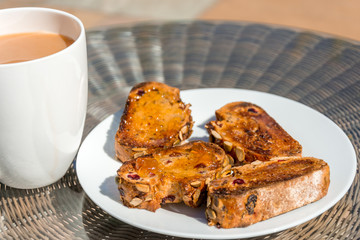seeded toast and marmalade with cup of tea