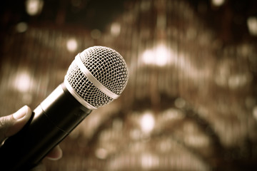 Microphone on abstract blurred of speech in seminar room or conference hall background