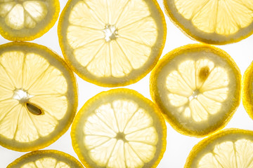 Bright citrus lemon slices on white