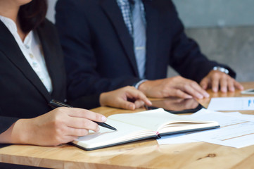 two business executives analyzing data paper at meeting room