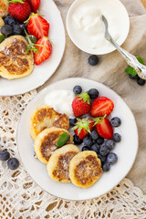 Cottage cheese quark pancakes syrniki with fresh berries