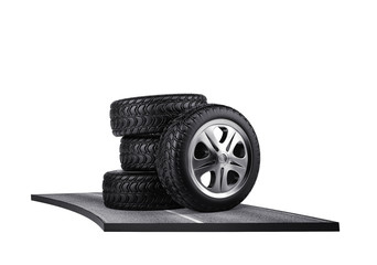 Four car tires on the asphalt. isolated on white. 3d render