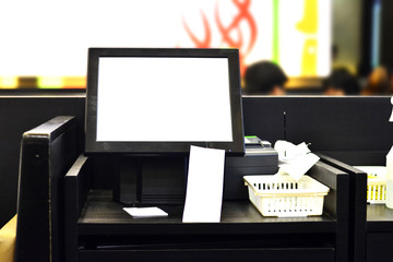 The blank computer screen and cashier machine in the restaraunt - Payment of concept