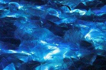 Blue waves background lit plastic