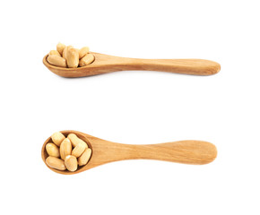 Spoon full of peanuts isolated