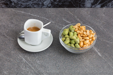 Cup of coffee and mixed nuts