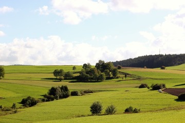 Landscape shot of a hill with blue sky