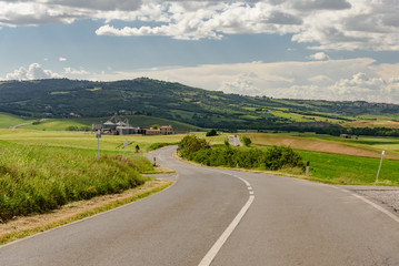 Perfect panorama of green hills with blue sky and fluffy clouds