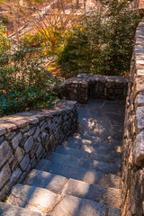 Stone stairs leading downward in the Stone Mountain Park in sunny autumn day, Georgia, USA