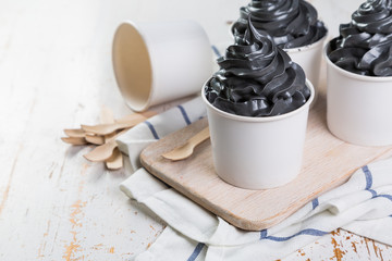 Black ice cream in white cups