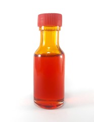 A bottle with orange liquid