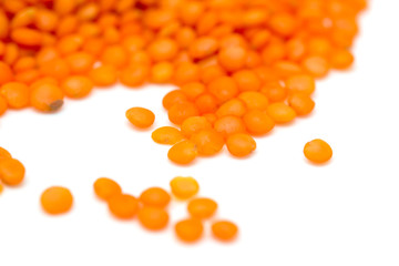 Red lentils on a white background
