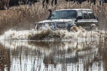 Jeep speeding through the water