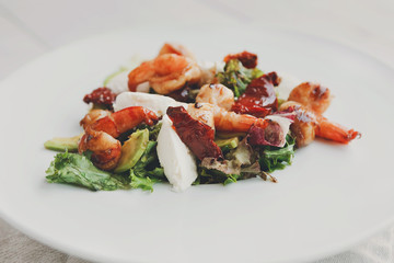 Traditional italian seafood salad with shrimps and mozzarella