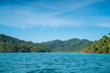 Island stand-alone on tranquil wave over sea