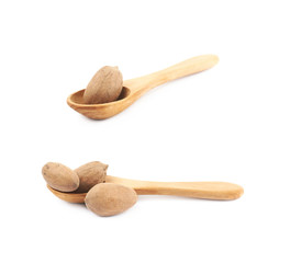 Wooden spoon and pecan nut composition