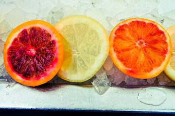Sliced grapefruit and lemon on ice, feel fresh.