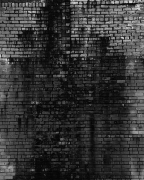 Old dark brick wall. Background, texture of a brick. Free space for your design. A blank for creativity