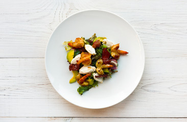 Traditional italian seafood salad with shrimps and mozzarella
