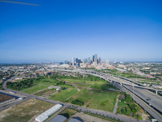 Fototapeta na wymiar Aerial view Houston downtown and interstate 69 highway with massive intersection, stack interchange and elevated road junction overpass at early morning from the northeast side of Houston, Texas, USA