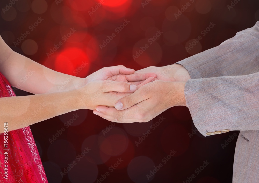 Poster hands holding together with sparkling light bokeh background