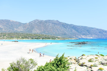 Sandy beach on an island with blue sea and blue sky