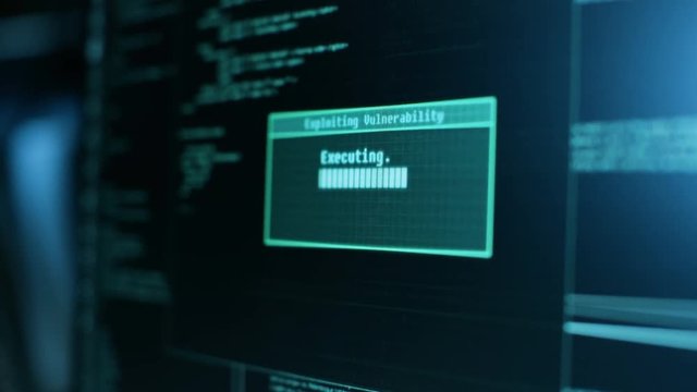 Display Showing Stages of Hacking in Progress: Exploiting Vulnerability, Executing and Granted Access.  Shot on RED EPIC-W 8K Helium Cinema Camera.