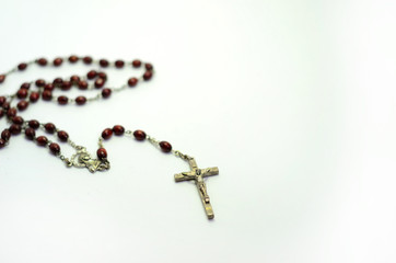 Rosary on white background
