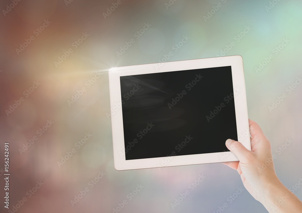Aufkleber hand with tablet with sparkling light bokeh background