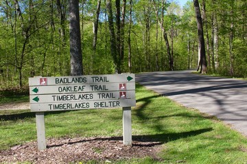 The trail sign at the park.