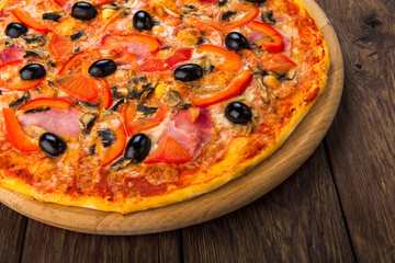 Delicious pizza with salami, mushrooms and olives