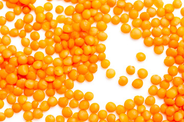 Red lentils on a white background