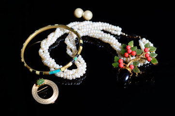 Antique vintage jewelry on black background
