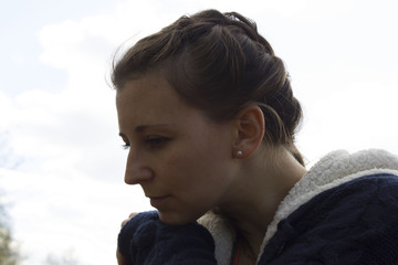 Portrait of sexy young stylish smiling woman girl model in bright modern summer white hipster cloth on the urban and nature background. Young active people. outdoors in the street.River, rocks and sky