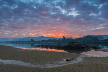 Sunrise on the banks of a river